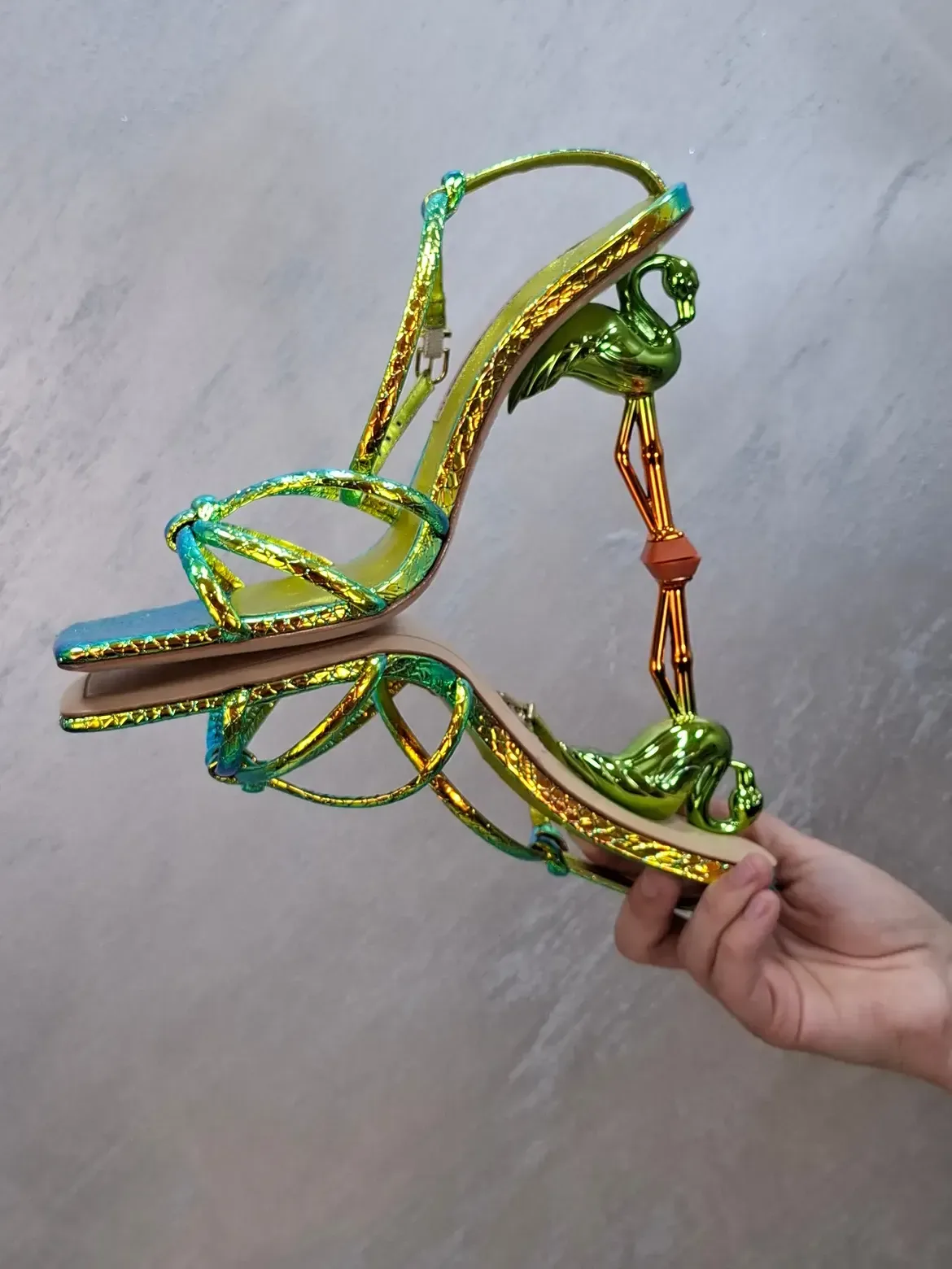 Neon yellow and green snakeskin-effect leather sandal with a sculptural metallic chrome flamingo heel